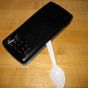 Using a plastic spoon to lever the case open